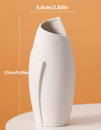 White minimalist ceramic vase detail on wooden shelf