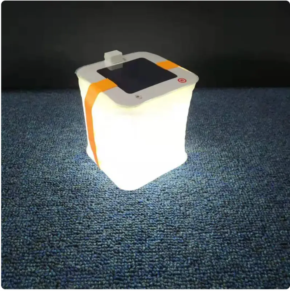 Waterproof solar LED lantern lit outdoors at dusk